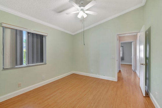 spare room featuring ceiling fan, light hardwood / wood-style flooring, crown molding, and a textured ceiling