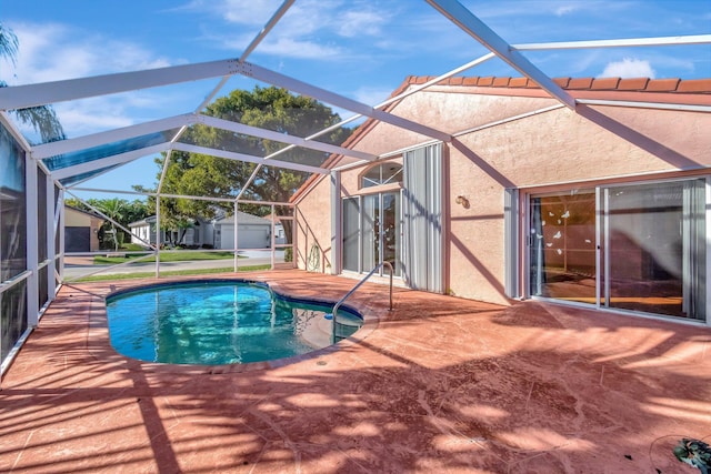 view of pool with a lanai and a patio