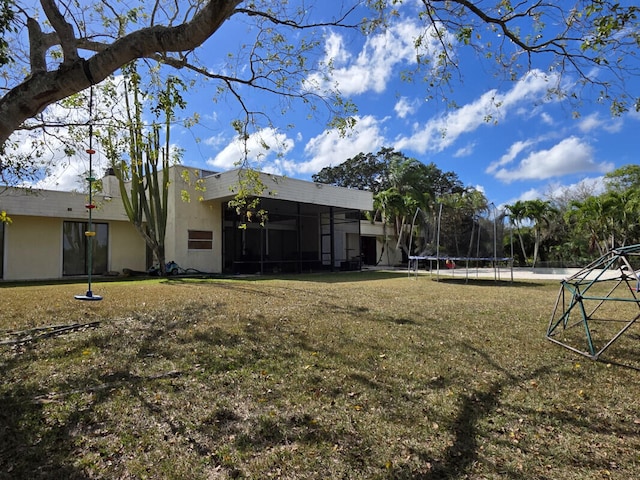 view of yard featuring a trampoline