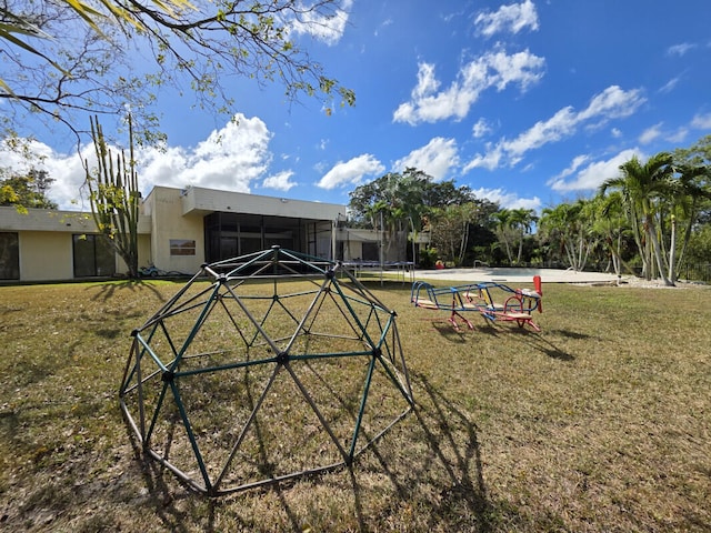 exterior space with a yard and a trampoline