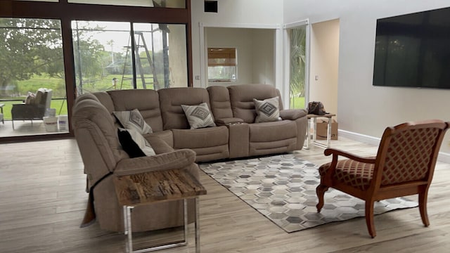 living area featuring wood finished floors and baseboards