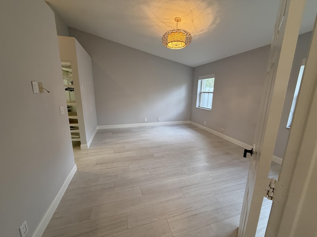 empty room with light wood-type flooring