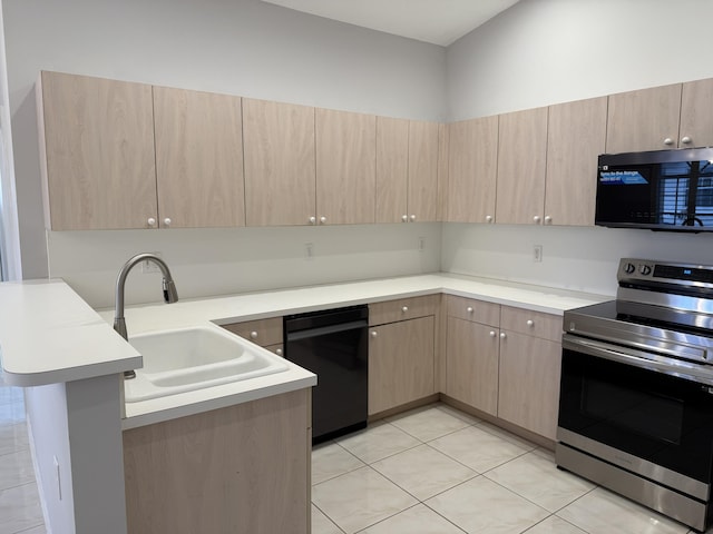 kitchen with dishwasher, light tile patterned flooring, kitchen peninsula, light brown cabinetry, and stainless steel stove