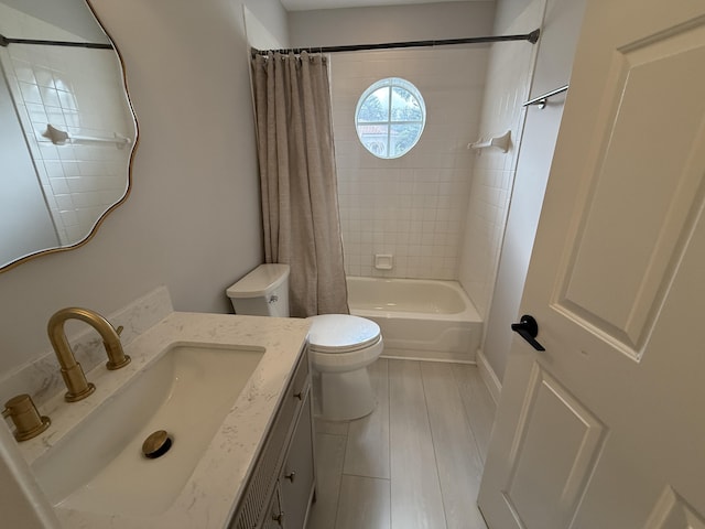 full bathroom with shower / tub combo, vanity, and toilet