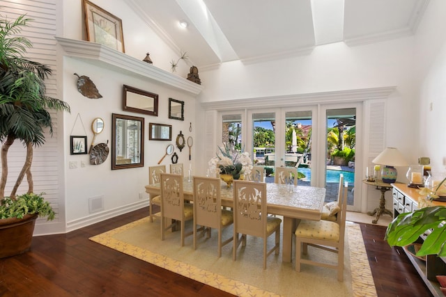 dining room featuring french doors, dark hardwood / wood-style floors, and high vaulted ceiling