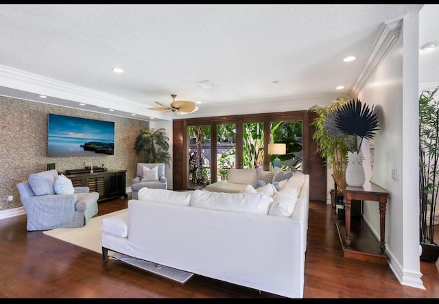 living room with dark hardwood / wood-style flooring, ceiling fan, and ornamental molding