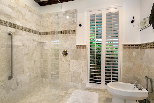 bathroom with tile walls, a bidet, and walk in shower