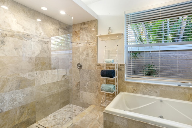 full bath with a garden tub and a walk in shower