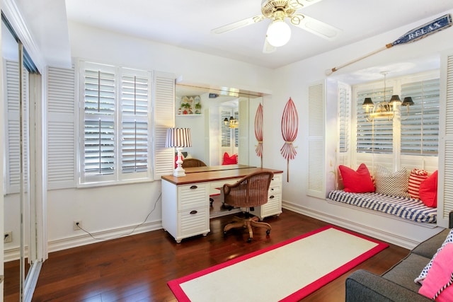 office space with wood finished floors, baseboards, and ceiling fan with notable chandelier