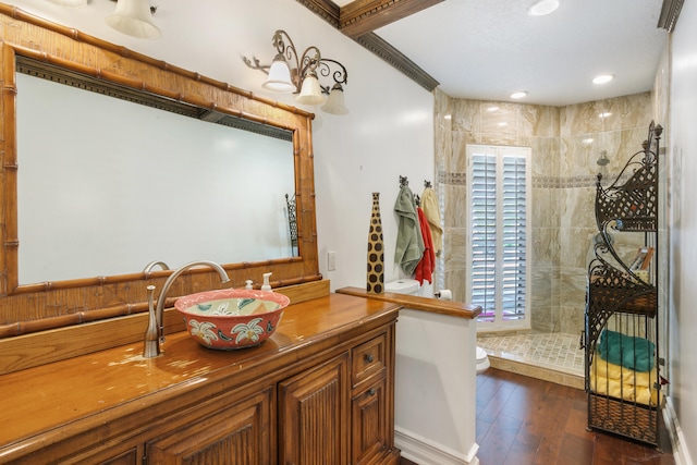 full bathroom featuring a walk in shower, wood finished floors, vanity, and recessed lighting