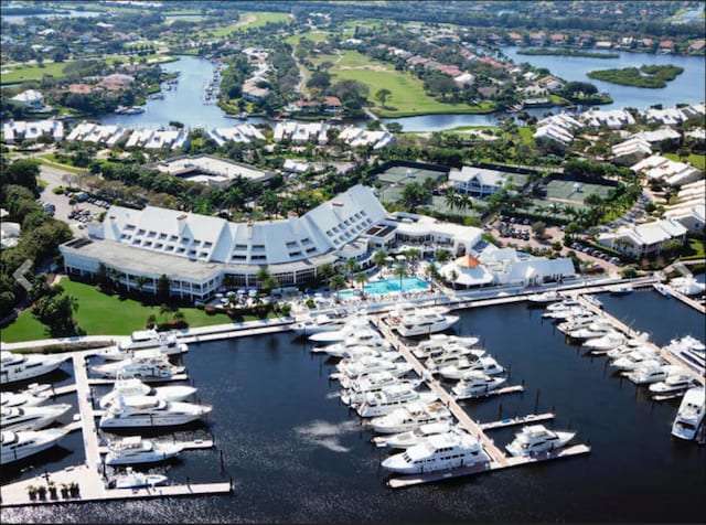 birds eye view of property with a water view