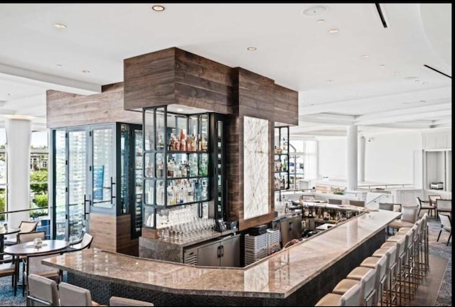 bar with a community bar and recessed lighting