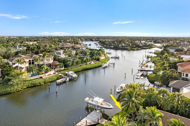 bird's eye view with a residential view and a water view
