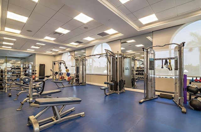 workout area with a raised ceiling