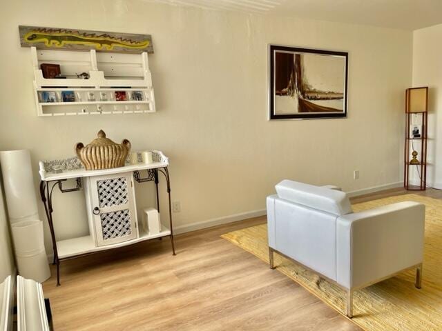 sitting room with light hardwood / wood-style floors