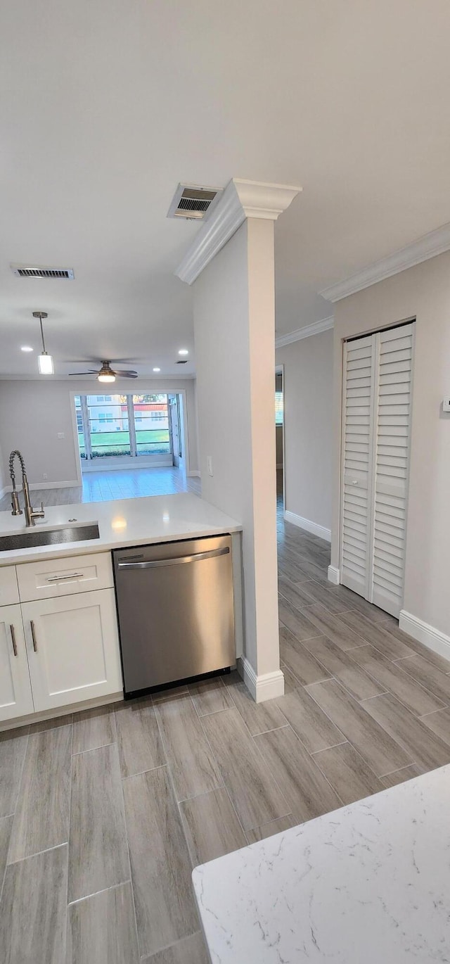 kitchen featuring white cabinetry, dishwasher, sink, and light wood-type flooring