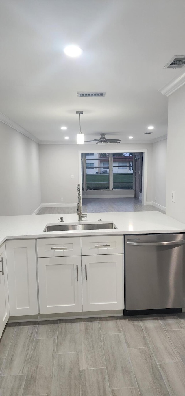 kitchen with dishwasher, light hardwood / wood-style flooring, white cabinetry, and sink