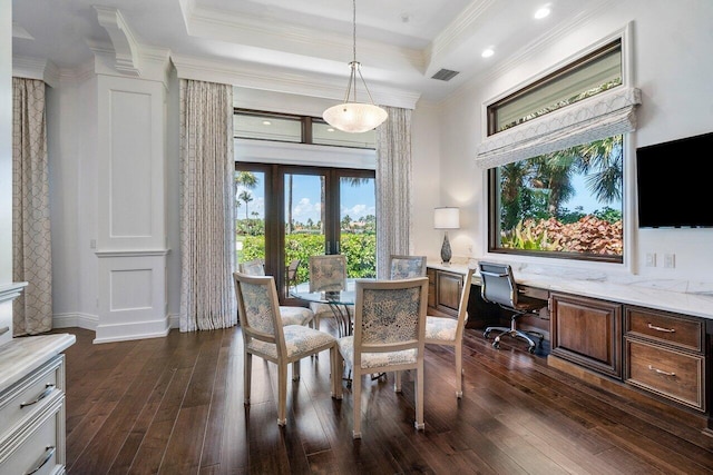 dining area with french doors, dark hardwood / wood-style flooring, a tray ceiling, and ornamental molding