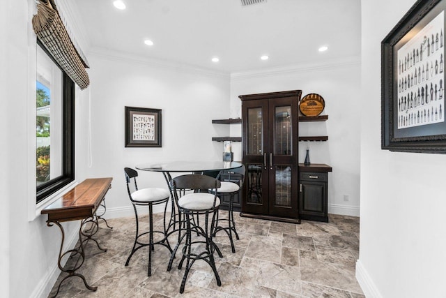 dining area with crown molding