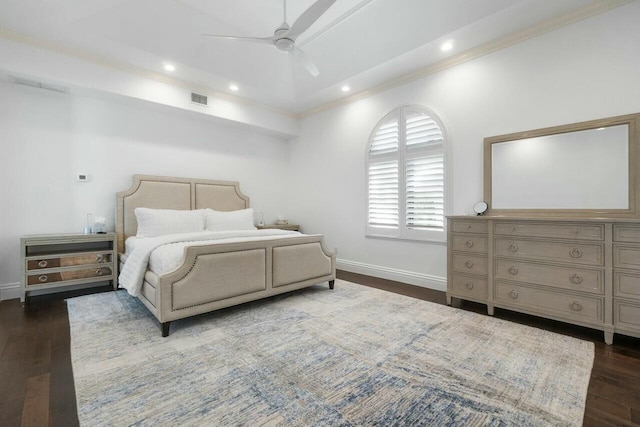 bedroom with dark hardwood / wood-style floors, ceiling fan, and ornamental molding