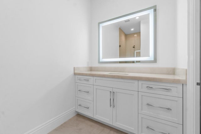 bathroom with vanity and walk in shower