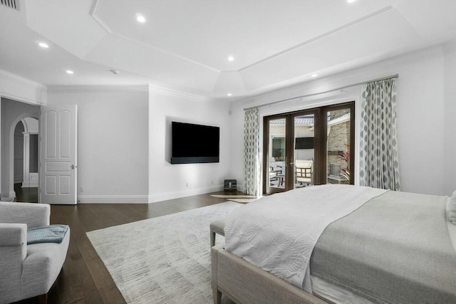 bedroom featuring access to outside, a tray ceiling, ornamental molding, and dark wood-type flooring