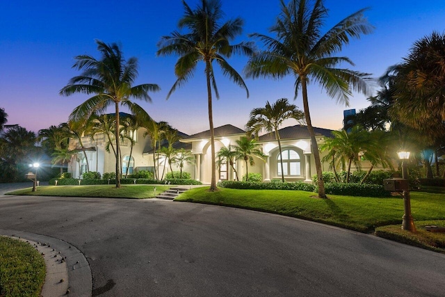 view of front of property with a yard