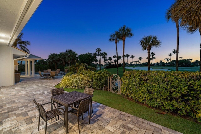 view of patio terrace at dusk