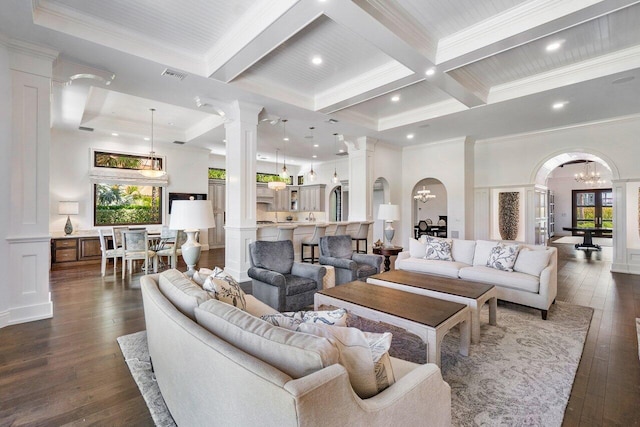 living room featuring beamed ceiling, dark wood-type flooring, coffered ceiling, and a notable chandelier