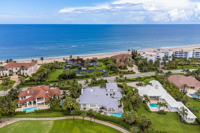 bird's eye view with a water view and a view of the beach