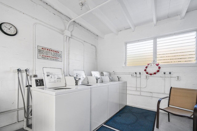 clothes washing area featuring washer and clothes dryer