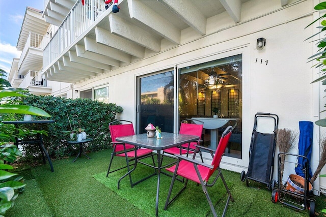 view of patio featuring a balcony