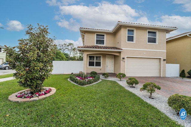 mediterranean / spanish-style home with a front lawn and a garage