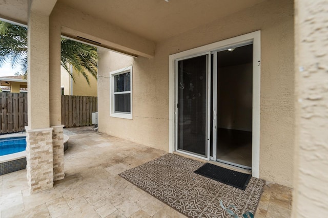 view of patio / terrace with a fenced in pool