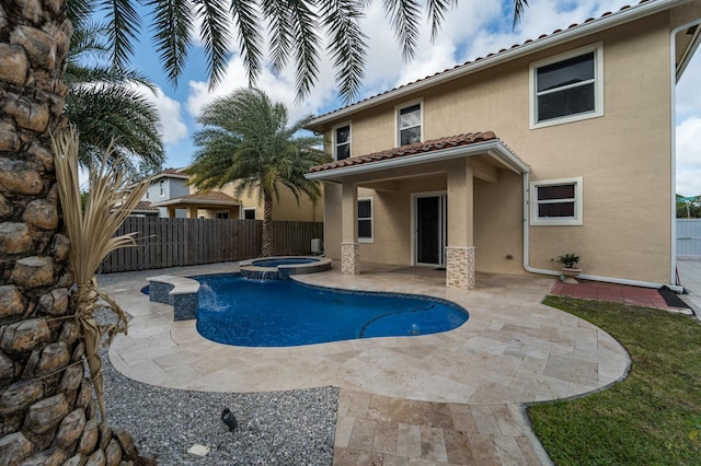 view of swimming pool with a patio area and an in ground hot tub