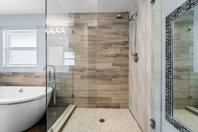 bathroom with a textured ceiling and plus walk in shower