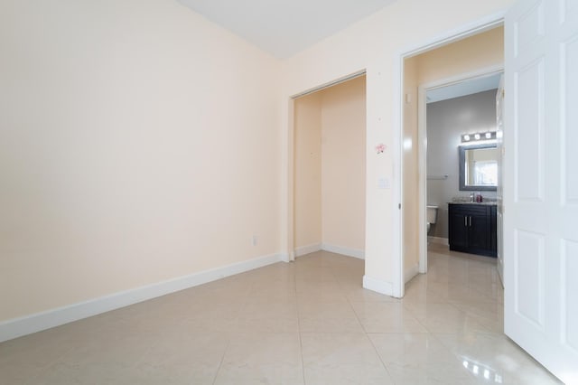 interior space featuring sink and light tile patterned floors