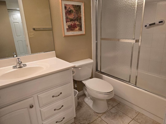 full bathroom with enclosed tub / shower combo, vanity, toilet, and tile patterned floors