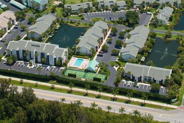 birds eye view of property with a water view