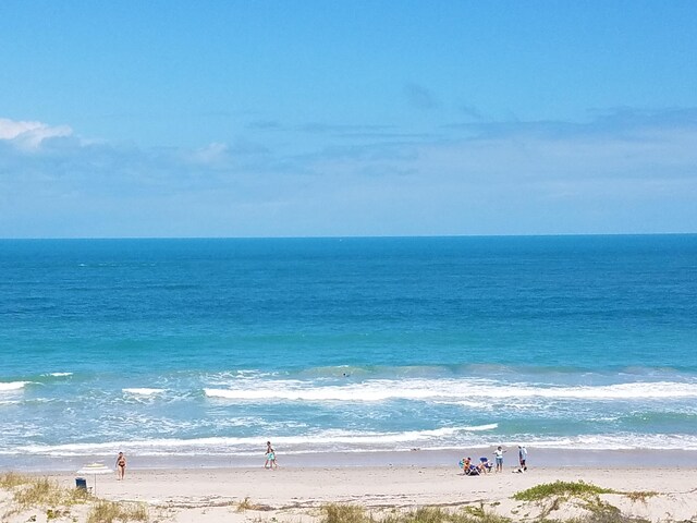 view of water feature with a beach view