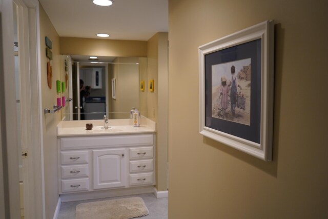 kitchen featuring white cabinets, kitchen peninsula, ceiling fan, and white fridge