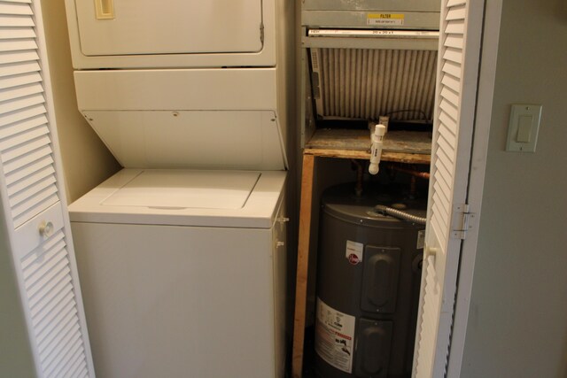 2400 S Ocean Dr Unit 1224, Fort Pierce, FL 34949 - laundry room with stacked washer / dryer and electric water heater