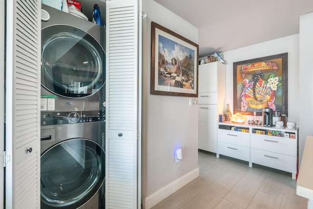 laundry room featuring stacked washer and dryer