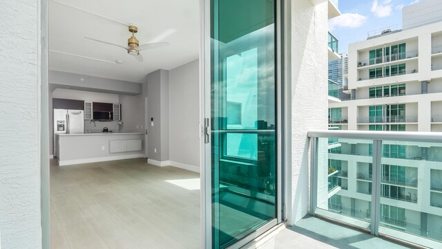 bathroom with a shower with door