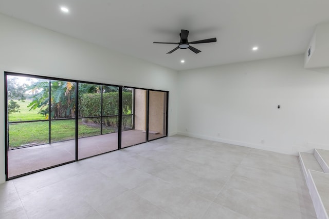 empty room featuring a wealth of natural light and ceiling fan