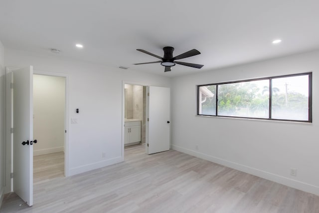 unfurnished bedroom with ceiling fan, light hardwood / wood-style floors, and connected bathroom