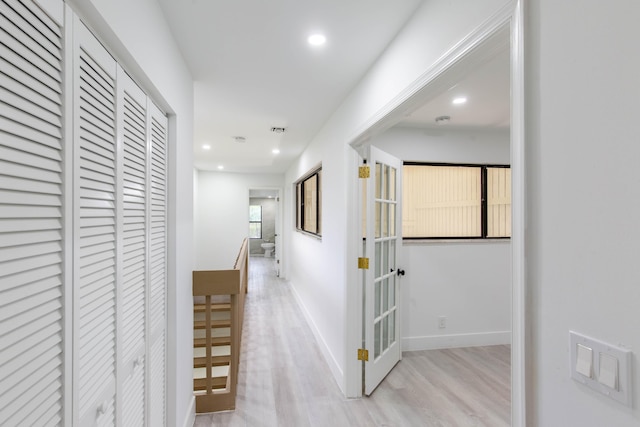 corridor featuring light hardwood / wood-style flooring