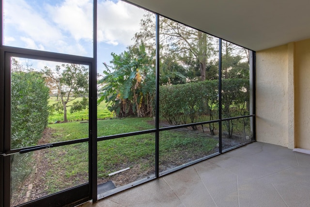 unfurnished sunroom with a wealth of natural light