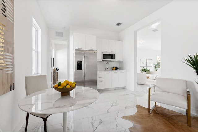 dining space featuring sink