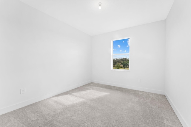 unfurnished room with light colored carpet